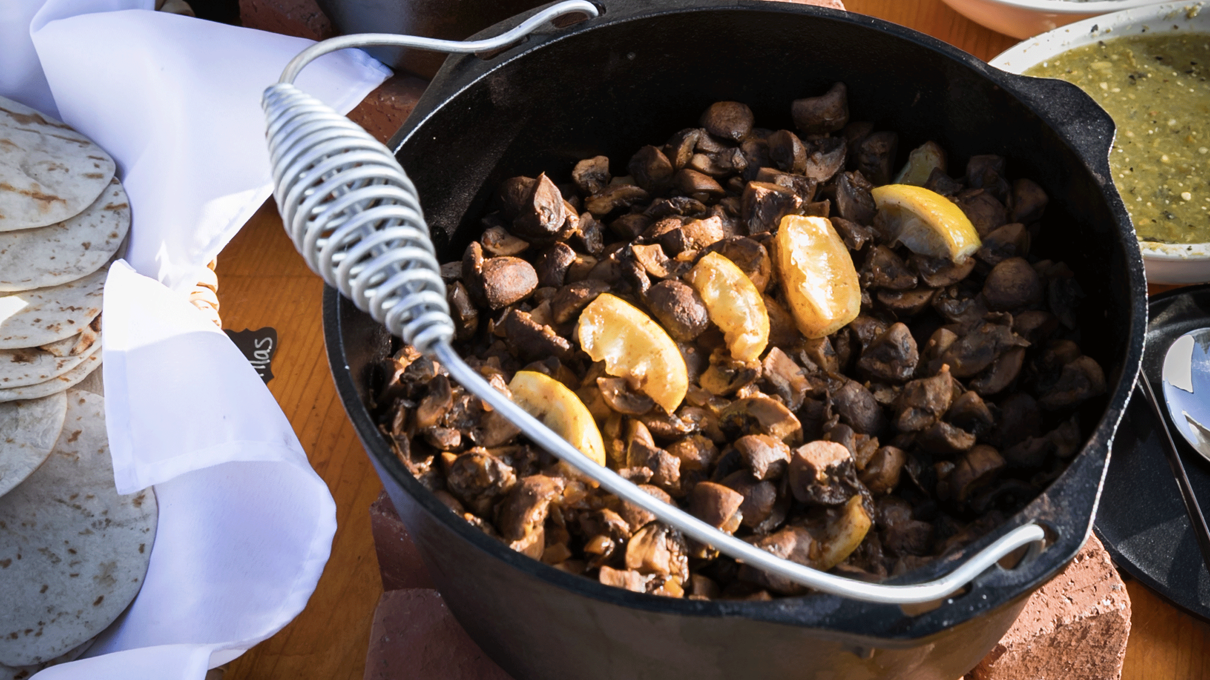 Sides of mushrooms in a cast iron pot